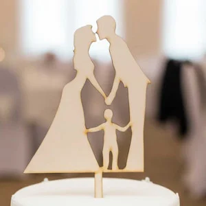 Wooden stake of newlyweds with a child